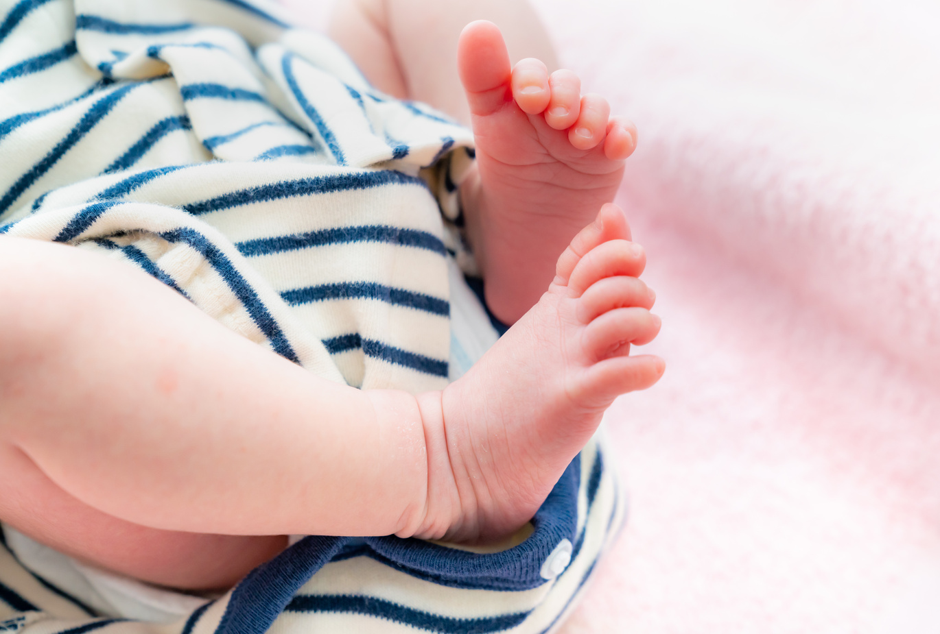 A photo of a small and cute newborn baby's foot. Image of baby and child-rearing.